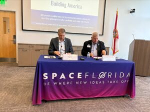 Robert Long and Peter Dyga sign the MOU